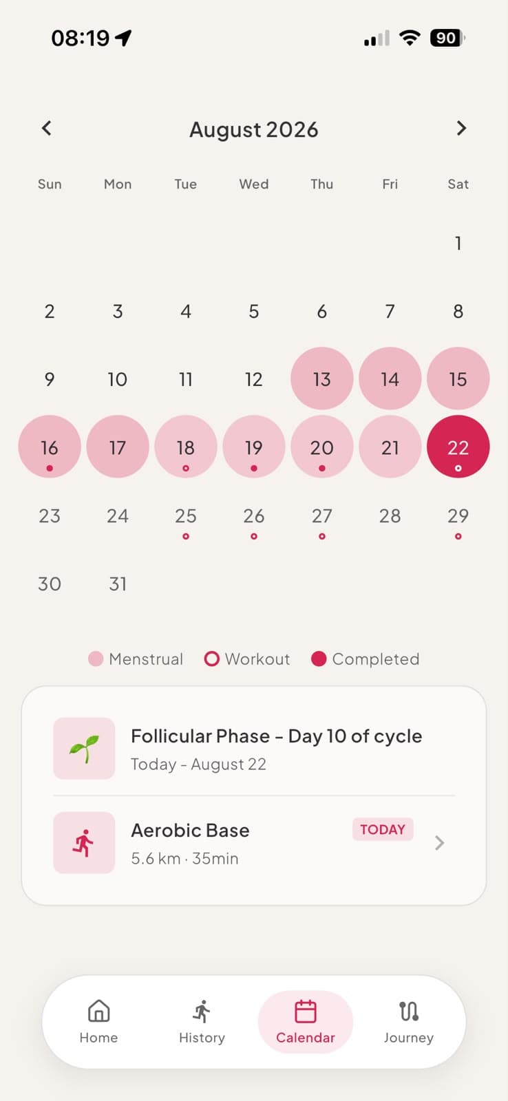 Tela de calendário da Lura com a fase do ciclo e os treinos do mês